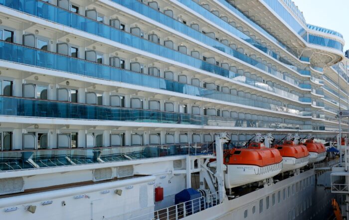 Obstructed view balconies on a cruise ship, partially blocked by lifeboats