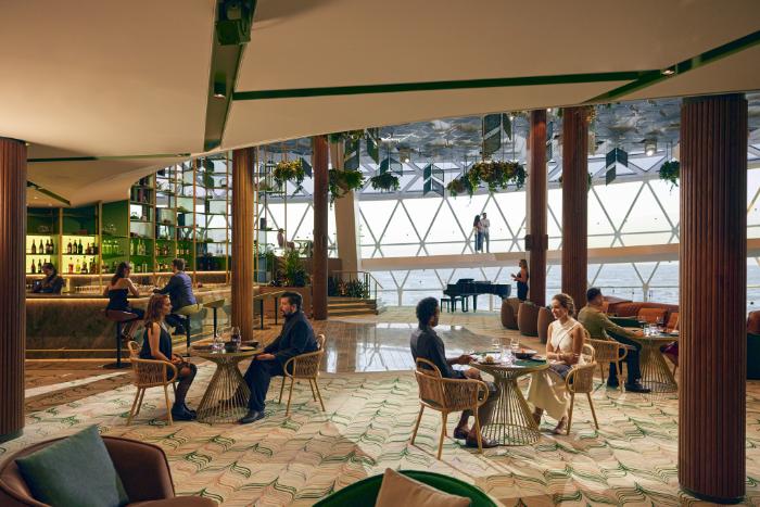 Celebrity Cruises Eden venue with lush greenery and performance space