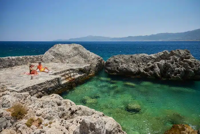 Monemvasia_swimming-gmpzqf- Windstar guests swimming in a secluded Mediterranean cove