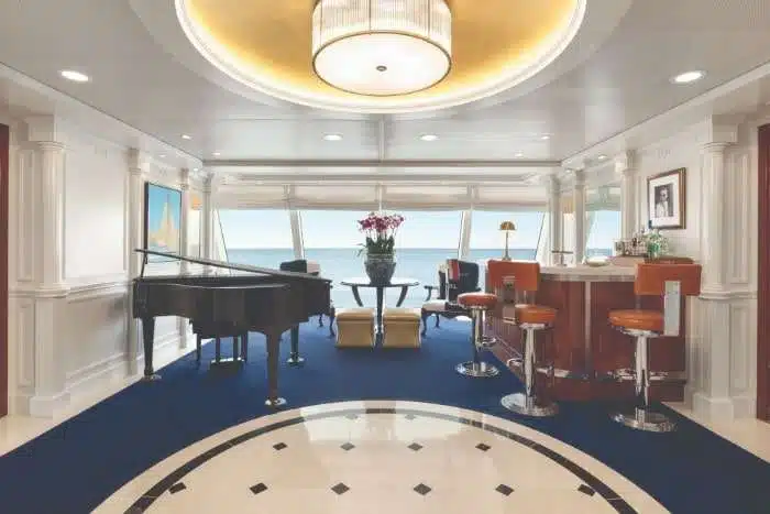 Oceania Cruises Owner Suite foyer with elegant furnishings