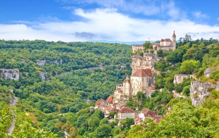 Rocamadour, France — a stunning medieval village built into limestone cliffs above the Alzou River valley, a highlight of Dordogne and Lot River cruises.