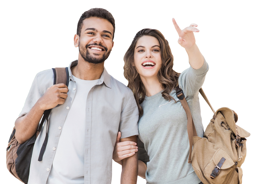Young couple with backpacks pointing upward while smiling together