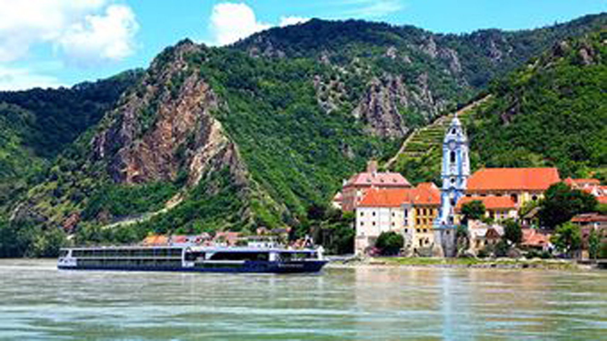 Cruise Ship on the Danube River at Dürnstein A river cruise ship from Avalon Waterways navigates past the picturesque village of Dürnstein