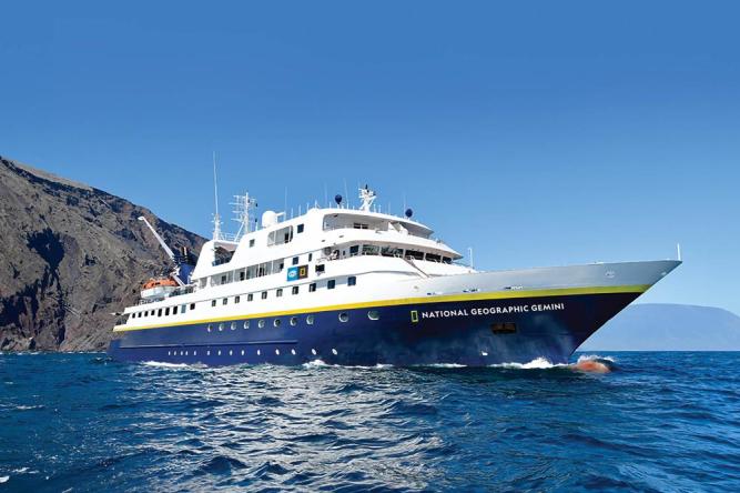National Geographic Gemini Expedition Cruise Ship The National Geographic Quest, a small expedition cruise ship designed for coastal exploration, shown navigating calm waters with its distinctive white superstructure and expedition-ready design featuring multiple observation decks.