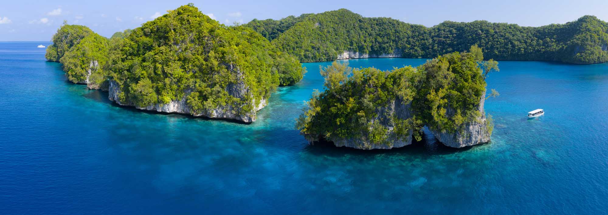 Stunning aerial photograph of Palau's iconic Rock Islands and Ulong Islands, showcasing lush