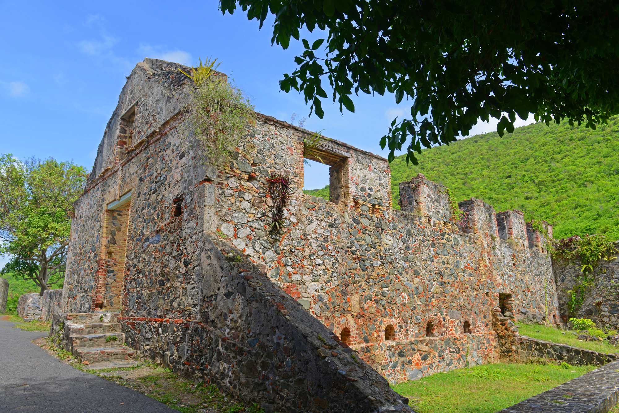 Historic stone ruins of Annaberg Sugar Plantation nestled in lush green hills, US Virgin Islands