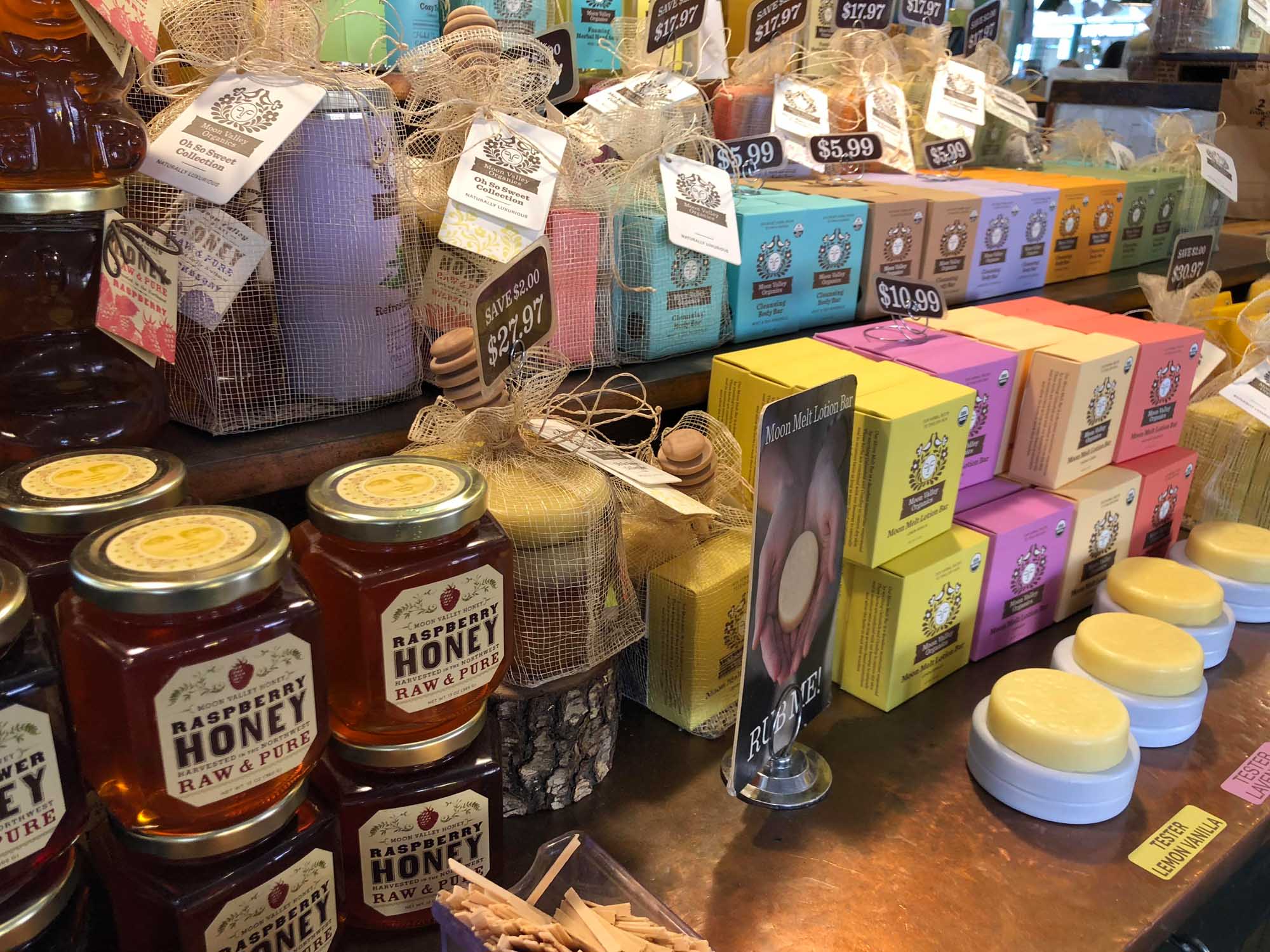 Handmade artisan soaps and natural products displayed on retail shelf at spa boutique
