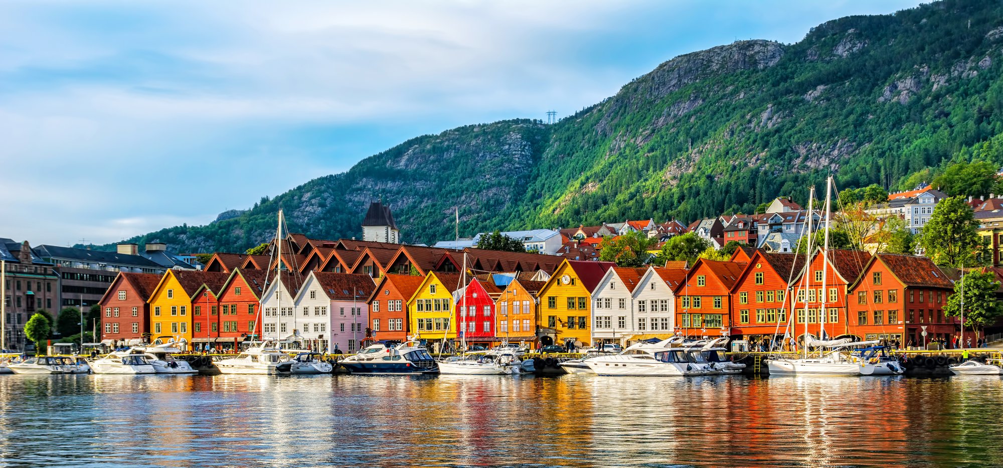 Colorful Waterfront Houses in Bergen, Norway A picturesque row of brightly colored traditional wooden houses lines the waterfront of Bergen