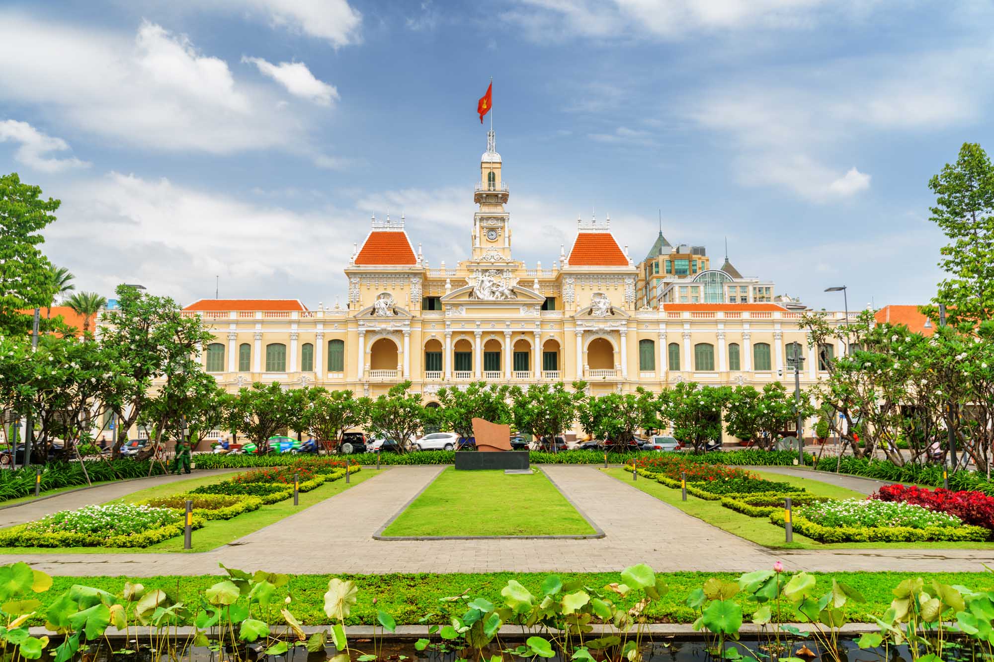 Ho Chi Minh City Hall with Gardens Ho Chi Minh City Hall's colonial architecture with manicured gardens and Vietnamese flag