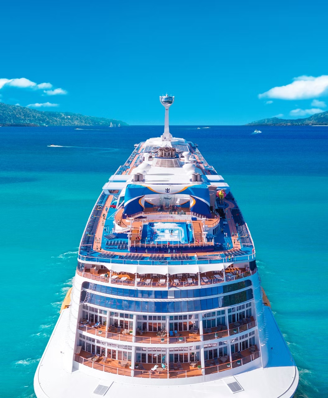 Aerial View of Royal Caribbean Cruise Ship An overhead aerial photograph of a large Royal Caribbean cruise ship navigating crystalline