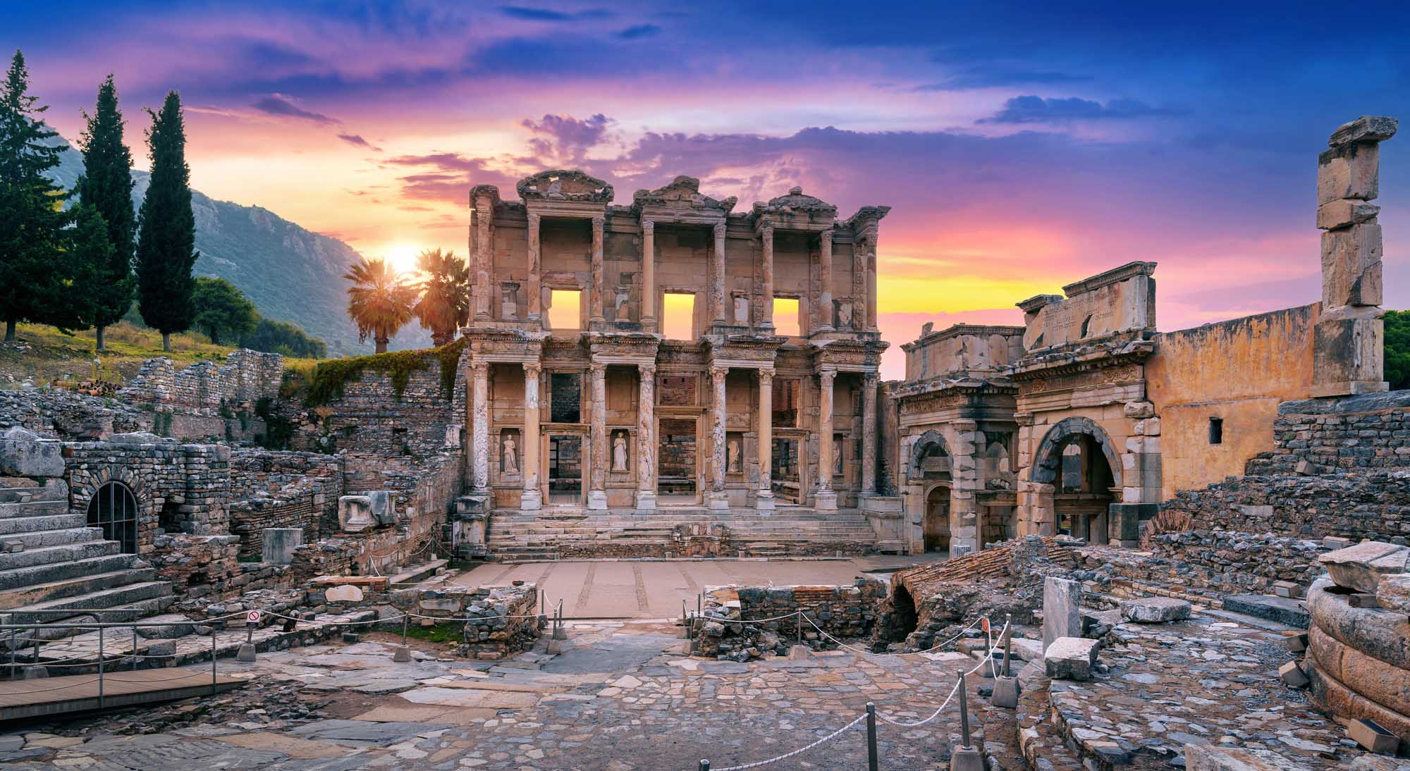 The magnificent facade of the Library of Celsus in Ephesus, Turkey, stands illuminated against