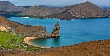 A stunning aerial view of the Galapagos Islands showcasing dramatic volcanic terrain, pristine