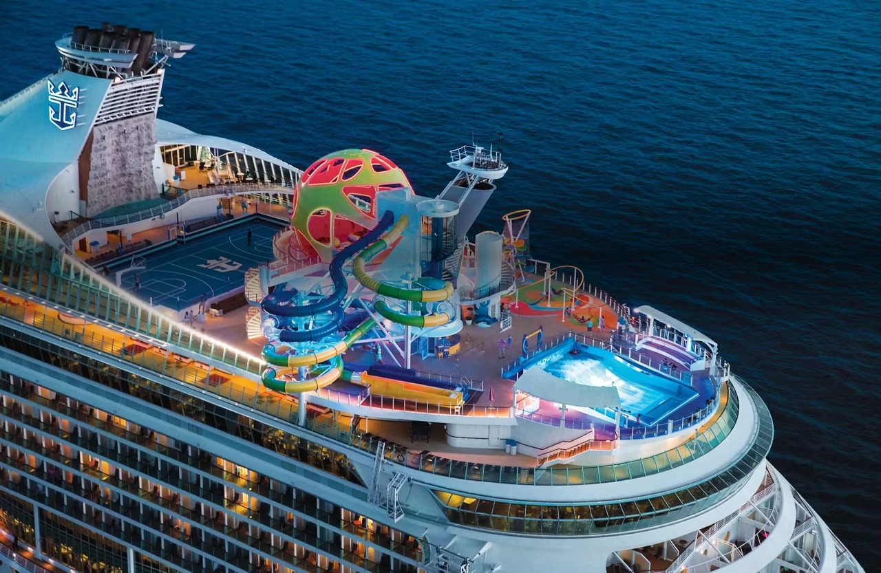 Royal Caribbean Mariner of the Seas Night Deck Lights An aerial view of Royal Caribbean's Mariner of the Seas cruise ship at night, showcasing