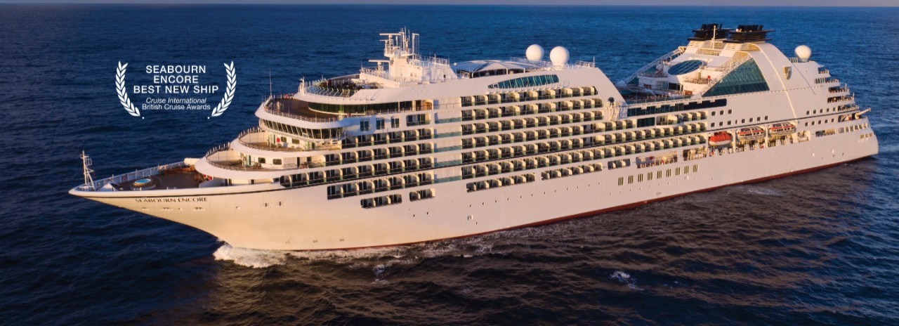 Seabourn Encore Luxury Cruise Ship at Sea A striking aerial view of the Seabourn Encore, an ultra-luxury cruise ship, sailing on deep blue