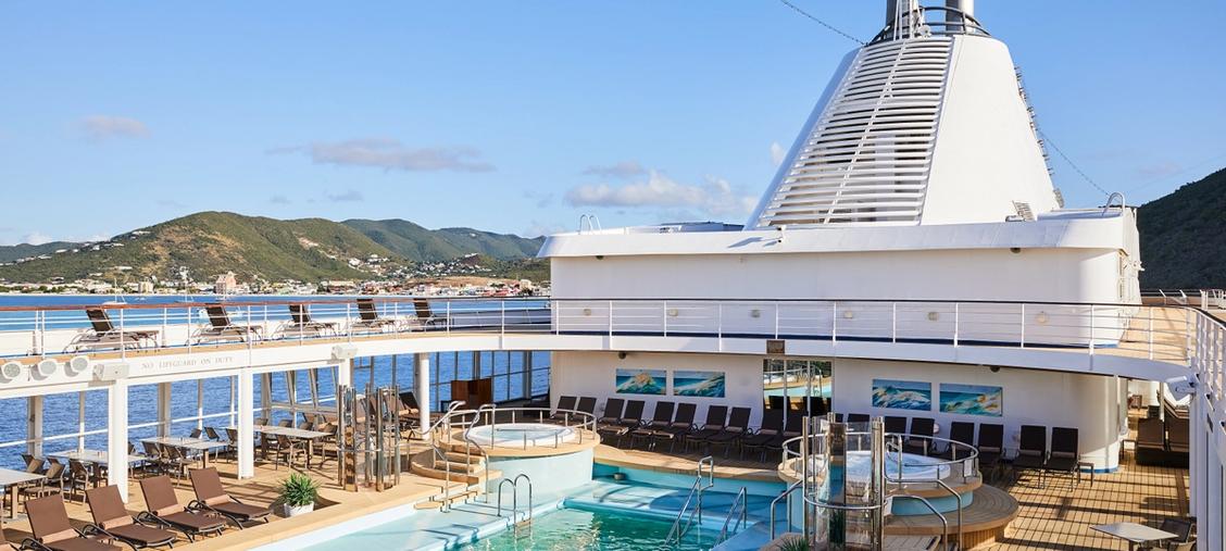 Silversea Luxury Cruise Ship Pool Deck An expansive pool deck aboard a Silversea cruise ship featuring multiple swimming pools, sun
