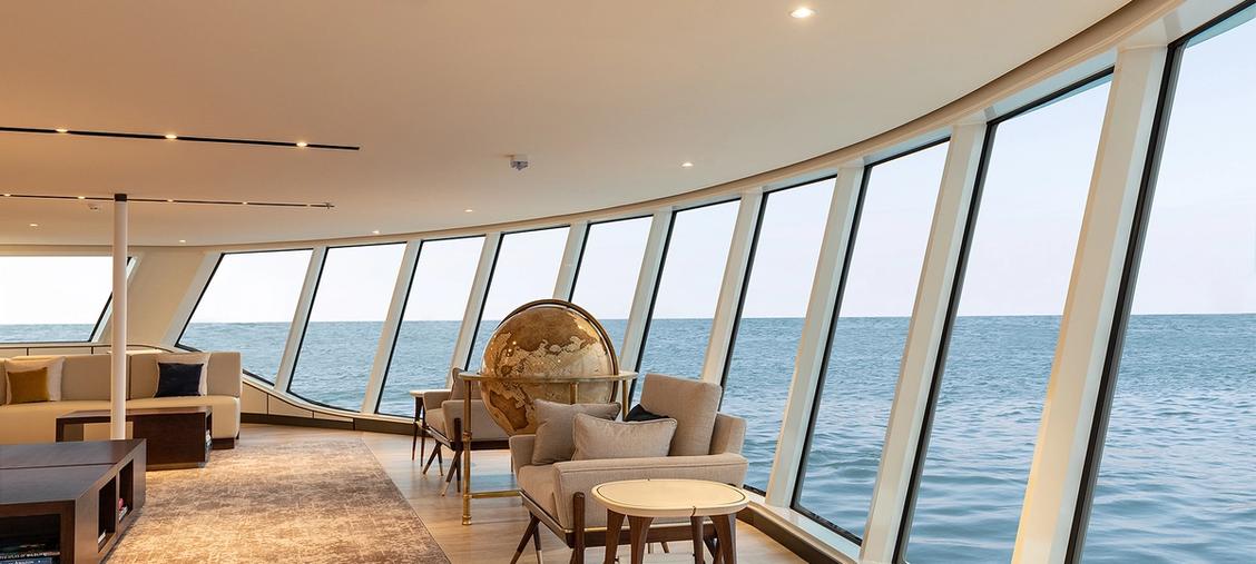 Silversea Luxury Lounge with Ocean Views An elegant and contemporary lounge aboard a Silversea cruise ship, featuring floor-to-ceiling