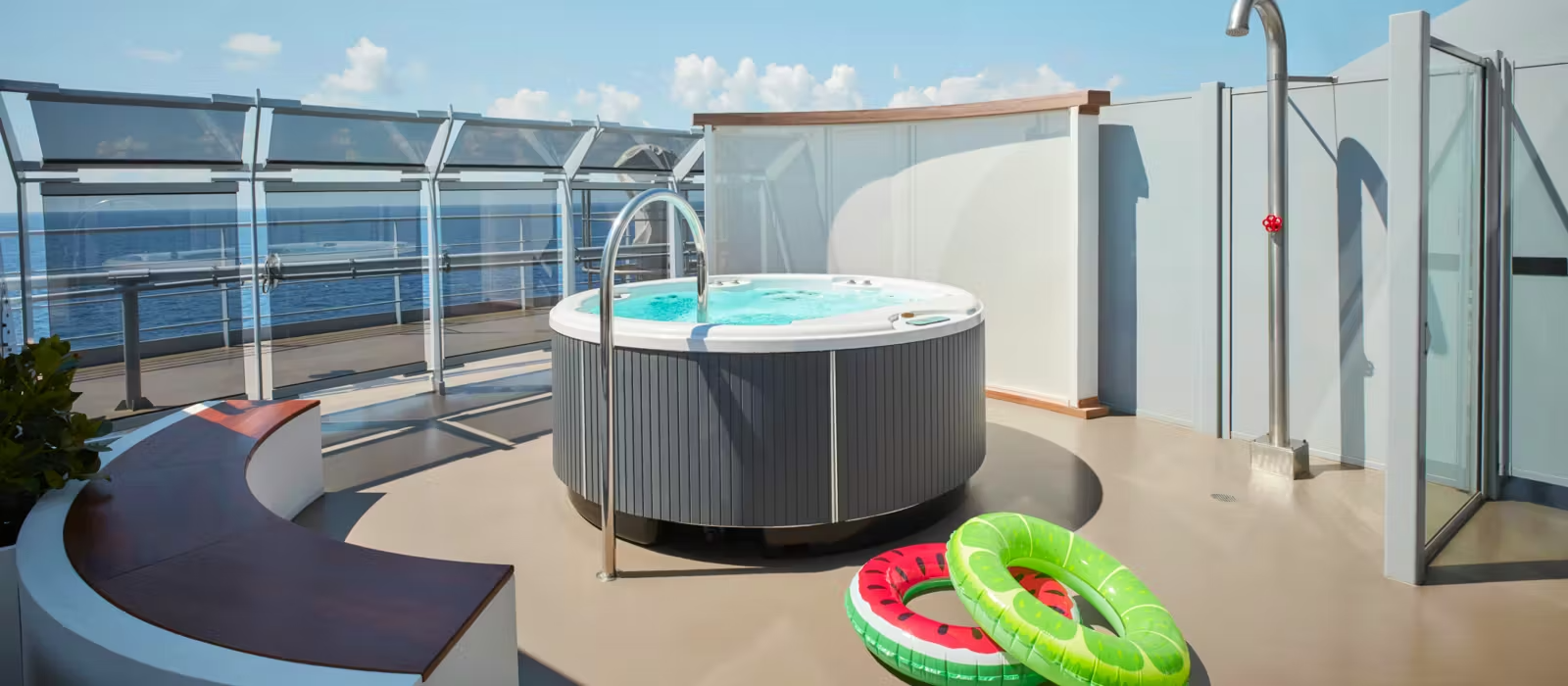 Virgin Voyages Brilliant Lady Hot Tub Deck A luxurious outdoor deck area aboard Virgin Voyages' Brilliant Lady cruise ship, featuring a modern